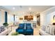 A well-lit living room with bar seating and open to the kitchen at 206 Yellow Snapdragon Dr, Davenport, FL 33837