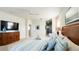Bright main bedroom featuring a ceiling fan, carpet, and ample natural light at 206 Yellow Snapdragon Dr, Davenport, FL 33837