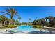 Resort style swimming pool with sun loungers and tropical landscaping at 206 Yellow Snapdragon Dr, Davenport, FL 33837