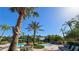 Community pool with sun loungers, tables and tropical landscaping at 206 Yellow Snapdragon Dr, Davenport, FL 33837