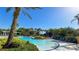 Resort style swimming pool with sun loungers and tropical landscaping at 206 Yellow Snapdragon Dr, Davenport, FL 33837