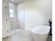 Modern bathroom boasts a freestanding tub, tiled shower, and contemporary fixtures at 2336 Sw 168Th Loop, Ocala, FL 34473