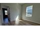 Bright bedroom with wood-look floors and a window bringing in natural light at 2336 Sw 168Th Loop, Ocala, FL 34473