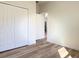 This bedroom has a neutral paint color, hardwood floors, and a closet at 2336 Sw 168Th Loop, Ocala, FL 34473