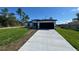 Charming single-story home boasts a concrete driveway and a two-car garage at 2336 Sw 168Th Loop, Ocala, FL 34473