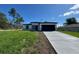 Charming single-story home boasts a concrete driveway and a two-car garage at 2336 Sw 168Th Loop, Ocala, FL 34473