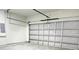 Spacious two-car garage with a white garage door and concrete floor at 2336 Sw 168Th Loop, Ocala, FL 34473
