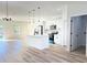 Bright, open kitchen featuring a center island, modern appliances, and wood-look flooring at 2336 Sw 168Th Loop, Ocala, FL 34473