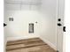 Laundry room with wood-look floors and hookups for a washer and dryer at 2336 Sw 168Th Loop, Ocala, FL 34473