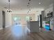 Open-concept living room and kitchen featuring modern appliances, island, and lots of natural light at 2336 Sw 168Th Loop, Ocala, FL 34473