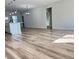 Bright open-concept living space with luxury vinyl flooring and modern lighting fixtures at 2336 Sw 168Th Loop, Ocala, FL 34473