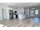 Open-concept living area with a modern kitchen, dining space, and stylish furnishings at 2336 Sw 168Th Loop, Ocala, FL 34473