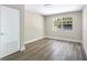 Bedroom with gray walls and modern wood-look flooring with bright natural light at 2536 Nw 3Rd Ave, Ocala, FL 34475