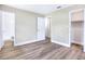 Bedroom showcasing neutral walls, modern flooring, and a walk-in closet for ample storage at 2536 Nw 3Rd Ave, Ocala, FL 34475