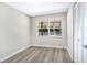 Well-lit bedroom with a closet and a large window overlooking the green backyard at 2536 Nw 3Rd Ave, Ocala, FL 34475
