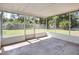 Enclosed patio overlooking the backyard, ideal for outdoor relaxation and entertainment at 2536 Nw 3Rd Ave, Ocala, FL 34475