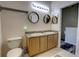Bathroom featuring double sinks, vanity, and a decorative mirror at 2935 Greenwood Springs Loop, Lake Mary, FL 32746