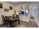 Inviting dining room open to kitchen with wood-look floors and dining table at 2935 Greenwood Springs Loop, Lake Mary, FL 32746