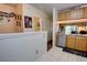 Open-concept kitchen with wood cabinets, granite countertops, and stainless steel dishwasher at 2935 Greenwood Springs Loop, Lake Mary, FL 32746