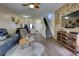 Inviting living room with hardwood floors, staircase, and comfortable seating arrangement at 2935 Greenwood Springs Loop, Lake Mary, FL 32746