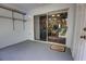 Enclosed porch featuring access to a serene outdoor space and convenient shelving at 2935 Greenwood Springs Loop, Lake Mary, FL 32746