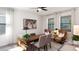 Bright home office space featuring large windows, stylish furnishings, and a neutral color palette at 314 Puma Loop, Groveland, FL 34736