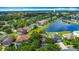 Beautiful aerial shot of a neighborhood with pond views and lush green landscaping at 3234 Amberley Park Cir, Kissimmee, FL 34743