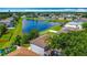 Scenic aerial perspective of homes near a pond, highlighting a Gathering-friendly neighborhood at 3234 Amberley Park Cir, Kissimmee, FL 34743