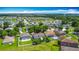 Lakeside neighborhood aerial view with lush greenery and picturesque homes at 3234 Amberley Park Cir, Kissimmee, FL 34743