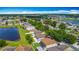 Overhead view showcasing community layout with lakes and neatly arranged homes at 3234 Amberley Park Cir, Kissimmee, FL 34743