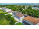 Aerial view of the backyard, showing the fence line, patio, and the surrounding neighborhood at 3234 Amberley Park Cir, Kissimmee, FL 34743