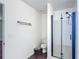 Contemporary bathroom featuring a glass-enclosed shower, toilet, and modern vanity with towel rack at 3234 Amberley Park Cir, Kissimmee, FL 34743