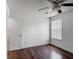 Relaxing bedroom featuring dark wood floors, a ceiling fan, and bright natural light at 3234 Amberley Park Cir, Kissimmee, FL 34743