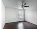 Well-lit bedroom with a ceiling fan and a window letting in natural light at 3234 Amberley Park Cir, Kissimmee, FL 34743