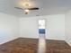 Large bedroom featuring gleaming hardwood floors and access to an ensuite bathroom at 3234 Amberley Park Cir, Kissimmee, FL 34743