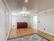 Light-filled dining room with hardwood floors, elegant trim, and a stylish chandelier at 3234 Amberley Park Cir, Kissimmee, FL 34743