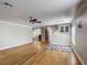 Expansive living room with hardwood floors, open layout, and neutral walls at 3234 Amberley Park Cir, Kissimmee, FL 34743