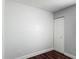 Room featuring clean lines, modern trim and rich dark hardwood flooring at 3234 Amberley Park Cir, Kissimmee, FL 34743