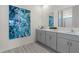 Elegant bathroom features a dual sink vanity with modern cabinets and quartz countertop at 3318 Arch Ave, Ormond Beach, FL 32174