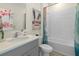 Well-lit bathroom with a shower-tub combo, decorative accents, and modern fixtures at 3318 Arch Ave, Ormond Beach, FL 32174