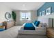Bright bedroom with lake view, blue accent wall, and modern furniture at 3318 Arch Ave, Ormond Beach, FL 32174