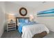 Inviting bedroom showcasing a well-made bed, soft lighting, and beachy decor at 3318 Arch Ave, Ormond Beach, FL 32174