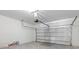 Spacious garage with an automatic door opener, ample storage, and a clean concrete floor at 3318 Arch Ave, Ormond Beach, FL 32174