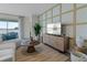 Comfortable living room features a decorative wall, sliding glass doors, and a stylish entertainment center at 3318 Arch Ave, Ormond Beach, FL 32174