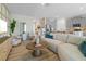 Open concept living room showcases neutral tones, stylish decor, and seamless flow to the kitchen at 3318 Arch Ave, Ormond Beach, FL 32174