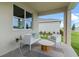 Inviting patio area with comfortable seating, neutral rug, and open-air design at 3318 Arch Ave, Ormond Beach, FL 32174
