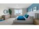 Relaxing bedroom with a dresser, mirror, large window, and beautiful scenic view at 3326 Arch Ave, Ormond Beach, FL 32174