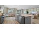 Open-concept kitchen with island and dining area with beautiful lake views at 3326 Arch Ave, Ormond Beach, FL 32174