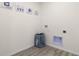 Practical laundry room corner with decor art, laundry bag, and convenient connections for appliances at 3326 Arch Ave, Ormond Beach, FL 32174