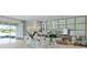An inviting view of a modern living room with stylish decor, plants, and natural light at 3326 Arch Ave, Ormond Beach, FL 32174